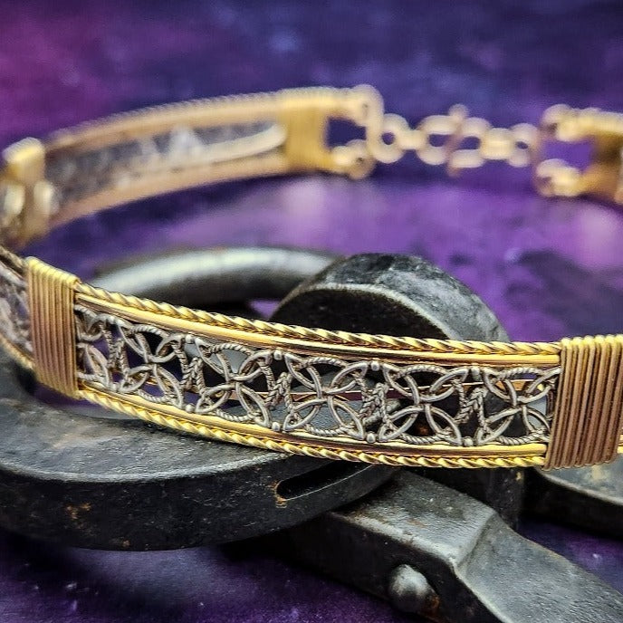 Elevate any ensemble effortlessly with the luxurious DEKKA Collar. The collar exhibits a unique and feminine style. Its open lattice work and both smooth and hand-twisted accents give it a striking elegance that can take you from dusk to dawn and garner attention wherever you go. Crafted with a luxurious combination of Art Deco-inspired sterling silver and accents in your choice of precious metals. 
