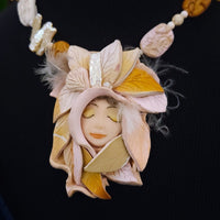 FOREST FAIRIES are ONE OF A KIND Artisan Necklaces. A sweet little fairy is caught napping in her nest of leaves. Each is a one of a kind piece of wearable art with her own unique look and personality. By Studio Navarri