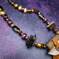 This is Forest Fairy SIENNA, a jazz singer in the Darkenwald community of Adina. Sienna’s husky voice will hypnotize you. Listen for it in the warm breezes of a summer night.  FOREST FAIRIES are ONE OF A KIND Artisan Necklaces by Studio Navarri