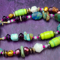 FOREST FAIRIES are ONE OF A KIND Artisan Necklaces. A sweet little fairy is caught napping in her nest of leaves. Each is a one of a kind piece of wearable art with her own unique look and personality. The faces are hand-painted and then surrounded by hand-cut leaves and collected beads, gemstones and sculpted treasures. By Studio Navarri