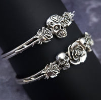 Embrace the unpredictable and add a touch of darkness to your fashion with our Goth Garden Cuffs. Lots of Skulls, Roses, Serpents and such. Let your spooky shine! By My Secret Heart Studios