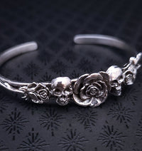 Embrace the unpredictable and add a touch of darkness to your fashion with our Goth Garden Cuffs. Lots of Skulls, Roses, Serpents and such. Let your spooky shine! By My Secret Heart Studios