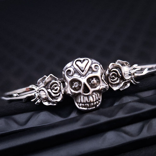 Embrace the unpredictable and add a touch of darkness to your fashion with our Goth Garden Cuffs. Lots of Skulls, Roses, Serpents and such. Let your spooky shine! By My Secret Heart Studios