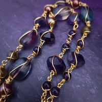 We all have a light within, an inner glow that others may see when they connect with our spirit. The shimmer and glow of this Labradorite Cabochon reminds me of this. This asymmetrical collar necklace is a testament to artisan craftsmanship and design. The Labradorite Cabochon is encased in a 14K Yellow Gold-Filled Wire Wrapped setting with a beautifully fluid look, and gold-wrapped pieces add a unique look.