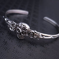Embrace the unpredictable and add a touch of darkness to your fashion with our Goth Garden Cuffs. Lots of Skulls, Roses, Serpents and such. Let your spooky shine! By My Secret Heart Studios