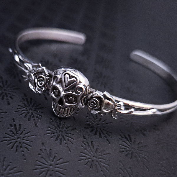 Embrace the unpredictable and add a touch of darkness to your fashion with our Goth Garden Cuffs. Lots of Skulls, Roses, Serpents and such. Let your spooky shine! By My Secret Heart Studios