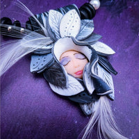 FOREST FAIRIES are ONE OF A KIND Artisan Necklaces. A sweet little fairy is caught napping in her nest of leaves. Each is a one of a kind piece of wearable art with her own unique look and personality. The faces are hand-painted and then surrounded by hand-cut leaves and collected beads, gemstones and sculpted treasures. By Studio Navarri