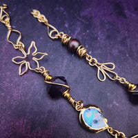 Feel empowered and beautiful wearing our exquisite Zasha Gemstone Collar, meticulously crafted with 14K gold-filled and stunning Amethyst gemstones. The hand-sculpted wire details, reminiscent of delicate flower petals, make this piece truly one of a kind. With a touch of elegance and sophistication, this statement collar will turn heads. 