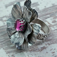 Take a journey to a summer cottage, gracefully adorned with climbing roses, clematis and wisteria. Invoke a feeling of warmth and tranquility with this sterling silver and pink sapphire COTTAGE ROSE Ring.