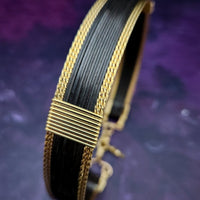 Be daring and adventurous with your style with the AMARI Collar. Crafted from a luxurious combination of blackened sterling silver and surrounded by hand-twisted accents, this collar will take you from dusk till dawn with an eye-catching elegance that will turn heads wherever you go.  Studio Navarri.