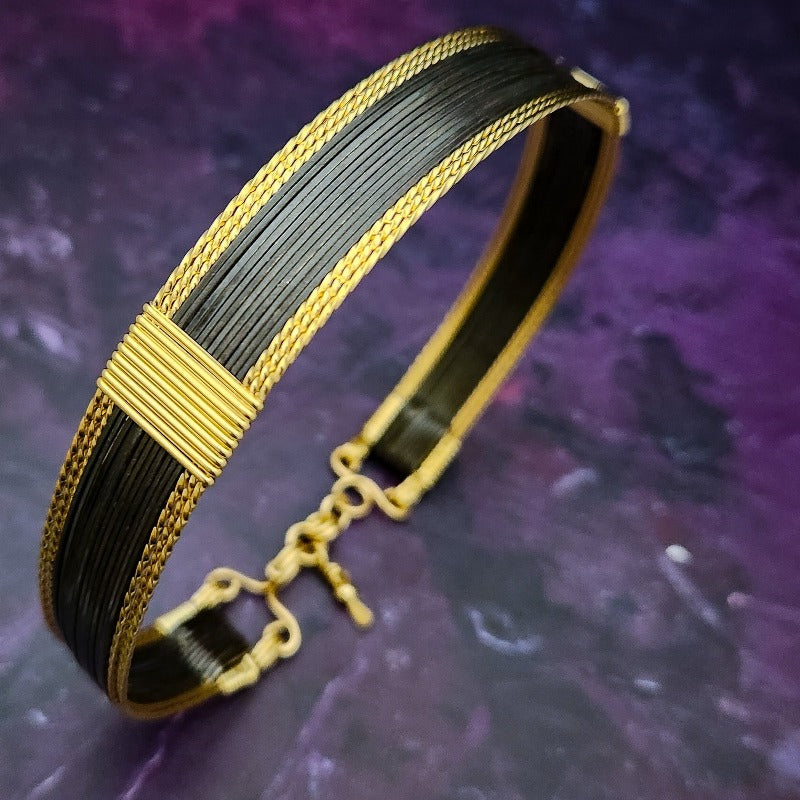 Be daring and adventurous with your style with the AMARI Collar. Crafted from a luxurious combination of blackened sterling silver and surrounded by hand-twisted accents, this collar will take you from dusk till dawn with an eye-catching elegance that will turn heads wherever you go.  Studio Navarri.