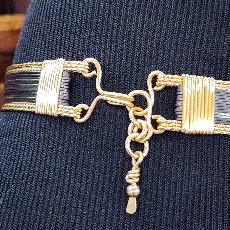Be daring and adventurous with your style with the AMARI Collar. Crafted from a luxurious combination of blackened sterling silver and surrounded by hand-twisted accents, this collar will take you from dusk till dawn with an eye-catching elegance that will turn heads wherever you go.  Studio Navarri.