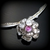 This stunning, handmade Rose of Aphrodite Pendant, crafted in sterling silver, symbolizes love and beauty, but also evokes enduring strength.