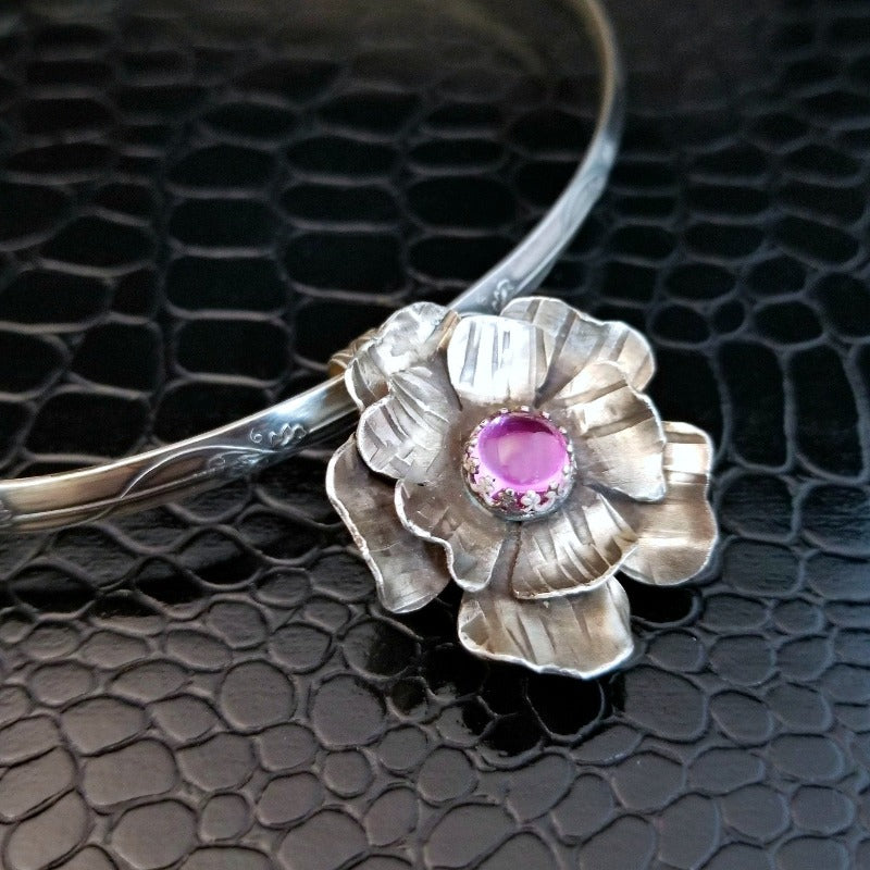 This stunning, handmade Rose of Aphrodite Pendant, crafted in sterling silver, symbolizes love and beauty, but also evokes enduring strength.