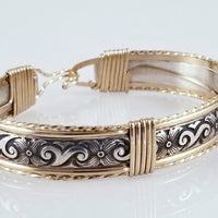 The ‘ZUZY’ collection, hand crafted in a flirty floral pattern of sterling silver and wire wrapped with gold accents.
