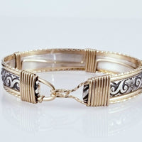 The ‘ZUZY’ collection, hand crafted in a flirty floral pattern of sterling silver and wire wrapped with gold accents.