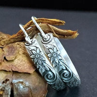 Wild Flower Hoop Earrings in sterling silver with handcrafted ear wires. Measures approx. 1 inch in diameter