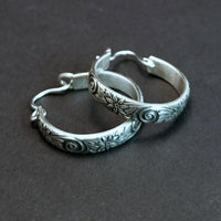 Wild Flower Hoop Earrings in sterling silver with handcrafted ear wires. Measures approx. 1 inch in diameter