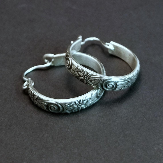 Wild Flower Hoop Earrings in sterling silver with handcrafted ear wires. Measures approx. 1 inch in diameter