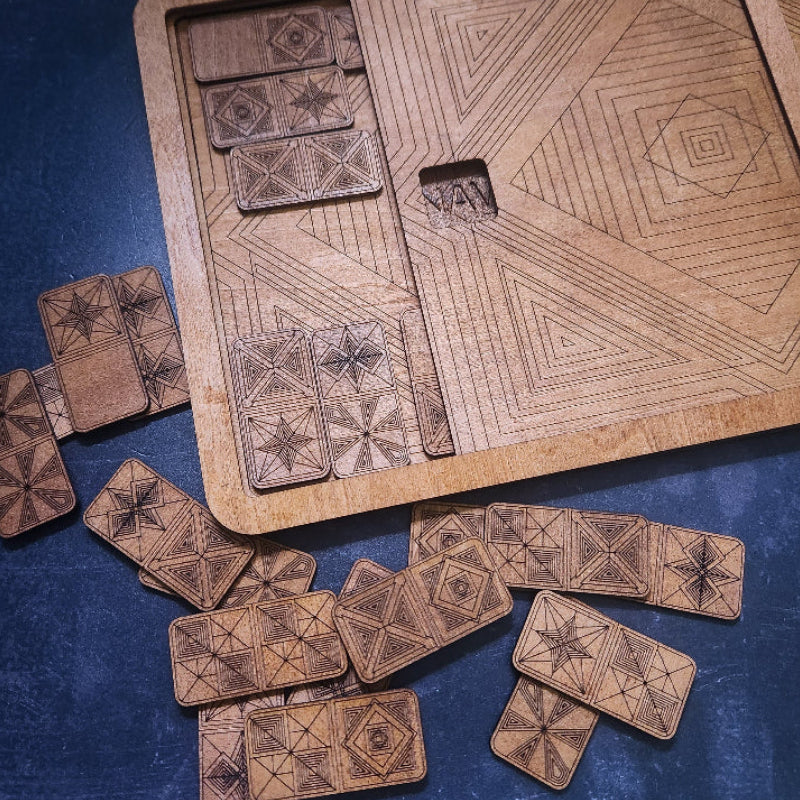 Wooden Artisan Dominos with geometric patterns and slide top storage box, By Studio Navarri, on a blue surface