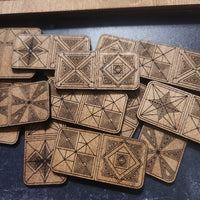 Artisan Wooden Dominos with geometric patterns and handcrafted Storage Box, by Studio Navarri, on a blue surface