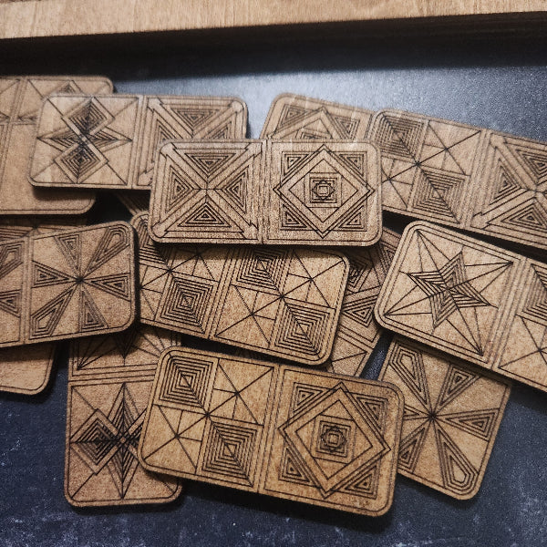 Artisan Wooden Dominos with geometric patterns and handcrafted Storage Box, by Studio Navarri, on a blue surface