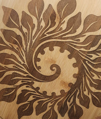 Wooden surface with intricate leaf pattern