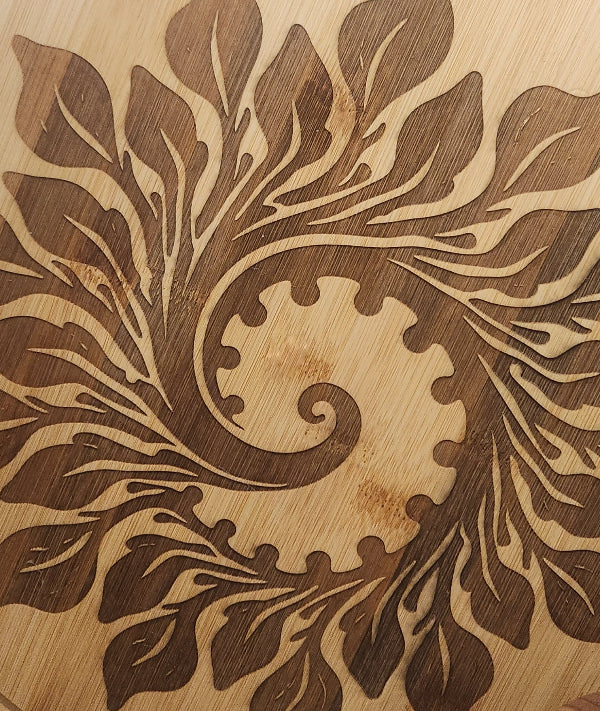 Wooden surface with intricate leaf pattern