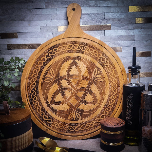 Wooden cutting board with Celtic knot design on a rustic background