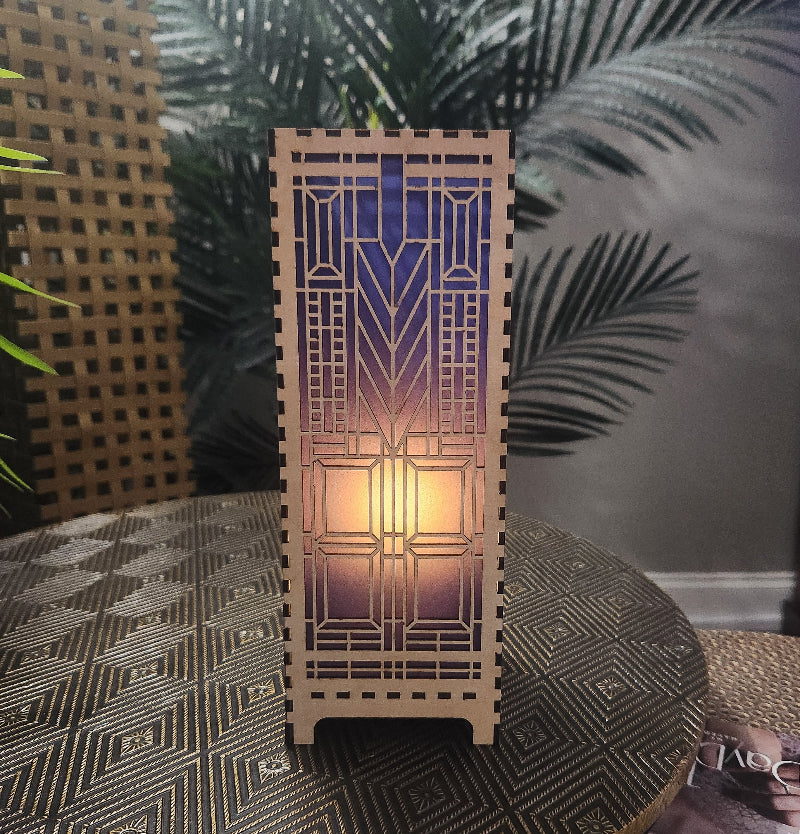 Domara LED lamp with Frank Lloyd Wright inspired Arts and Craftsman styled lamp on a dark surface next to a plant
