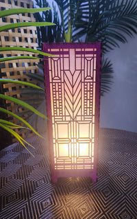 Decorative lamp with geometric pattern on a textured surface