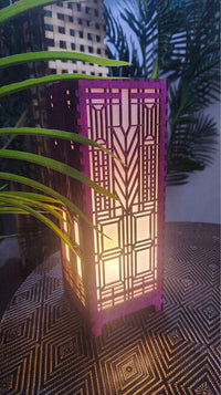 Decorative lamp with geometric pattern on a textured surface