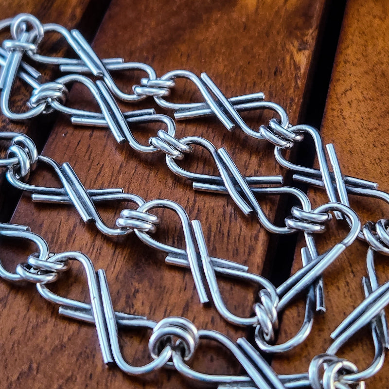 Metal chain on a wooden surface