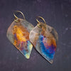 Pair of hammered copper earrings with flame kissed patina, by Studio Navarri