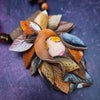 This is Forest Fairy SIENNA, a jazz singer in the Darkenwald community of Adina. Sienna’s husky voice will hypnotize you. Listen for it in the warm breezes of a summer night.  FOREST FAIRIES are ONE OF A KIND Artisan Necklaces by Studio Navarri