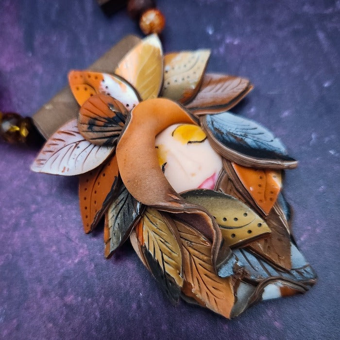 This is Forest Fairy SIENNA, a jazz singer in the Darkenwald community of Adina. Sienna’s husky voice will hypnotize you. Listen for it in the warm breezes of a summer night.  FOREST FAIRIES are ONE OF A KIND Artisan Necklaces by Studio Navarri