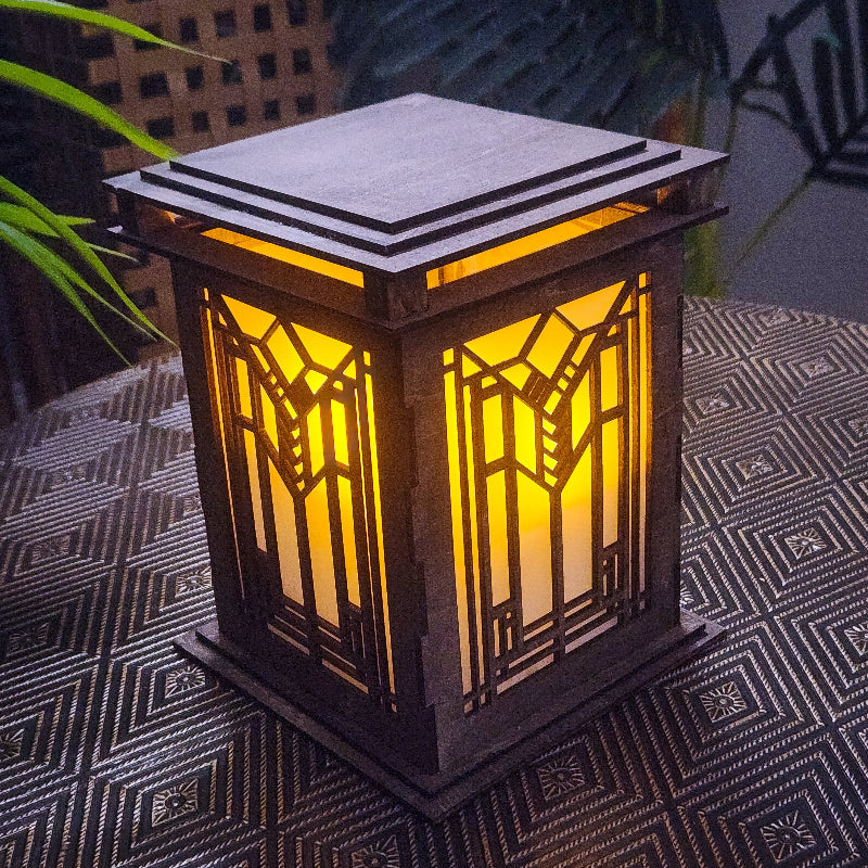 Arts & Craftsman styled lantern with geometric design on a textured surface