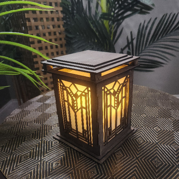 Decorative lantern with geometric pattern on a textured surface with plants in the background