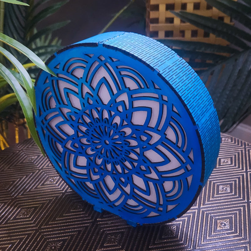 Blue decorative object with intricate patterns on a textured surface