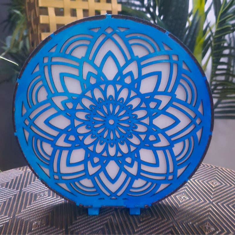 Blue decorative object with intricate patterns on a textured surface