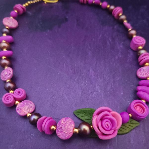 My mother, Remona, had an intense love for all flowers, so I wanted to pay homage to her by creating floral designs in her memory.  These Rose Necklaces are hand sculpted with a blend of polymer clays and combined with handcrafted beads and leaves.  Each is One-Of-A-Kind and Ready to Ship  Approx. 18 inches with a lobster clasp.