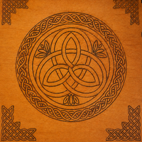 A square wooden plaque or box lid featuring a Celtic design. The center is a circular triquetra (trinity knot) motif in dark brown, surrounded by a matching circular border and decorative corner flourishes in the four corners, all on a warm orange-brown wood grain background.