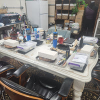 worktable with various items in a workshop setting