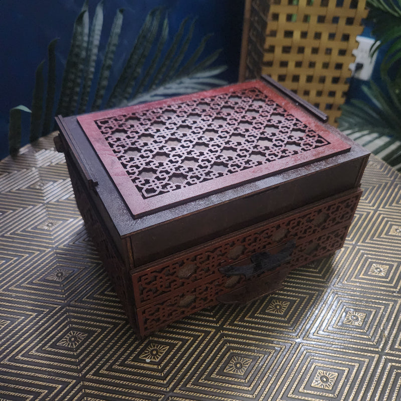 Decorative wooden box with intricate carvings on a patterned surface