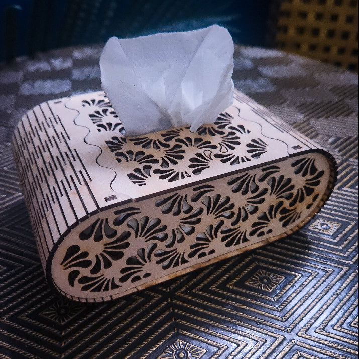 Decorative tissue box with floral patterns on a textured surface