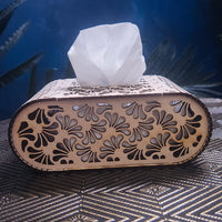 Decorative tissue box with floral patterns on a textured surface