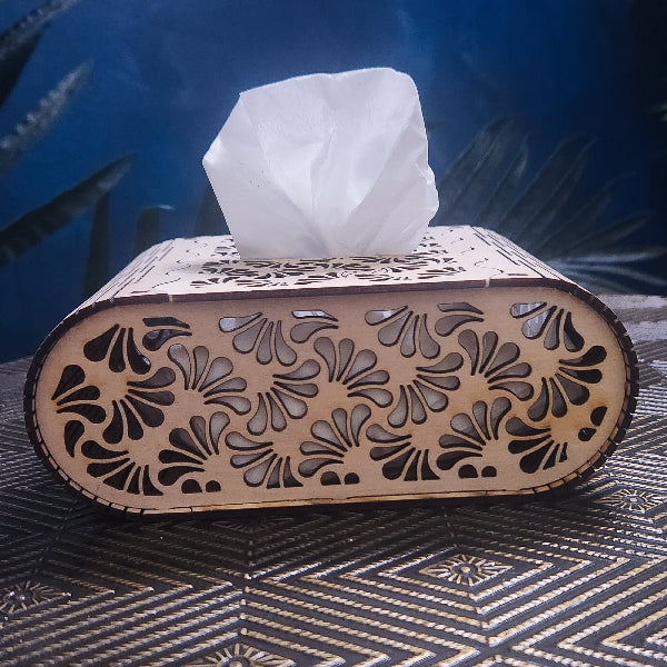 Decorative tissue box with floral patterns on a textured surface