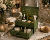 Green jewelry box with skincare products on a bathroom counter