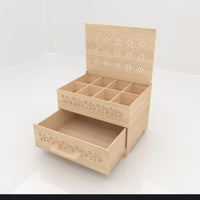 Wooden jewelry box with drawers on a white background