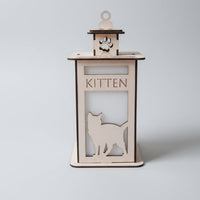 Wooden cat-shaped kitten feeder with 'KITTEN' text on a light gray background